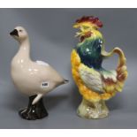 A French novelty cockerel jug and a glazed duck height 39cm