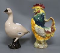 A French novelty cockerel jug and a glazed duck height 39cm