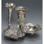 Two silver bonbon dishes and two silver posy vases.