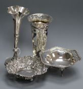 Two silver bonbon dishes and two silver posy vases.