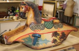 A painted wood rocking horse