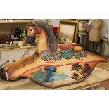 A painted wood rocking horse