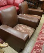 A pair of leather club chairs