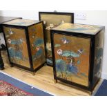 A pair of Chinese lacquered cabinets and a lacquered panel W.55.5cm and 61cm