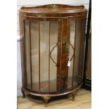 A lacquered bow-fronted display cabinet W.90cm