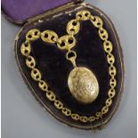 A cased Victorian pinchbeck oval locket on large link chain, locket 50mm.