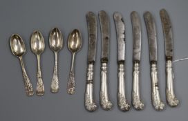 A set of six George V silver pistol handled fruit knives, a set of four unmarked lace back