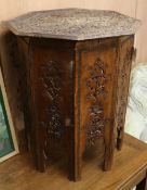 An Indian carved hardwood occasional table W.65cm