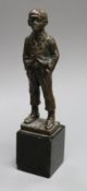 After Morath, a bronze figure of a young boy smoking a cigarette, signed, on black marble base, H