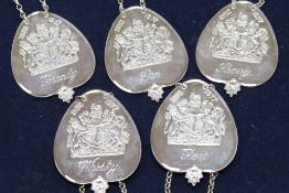 A set of five silver QEII Silver Jubilee commemorative heart shaped wine labels by Roberts & Belk,