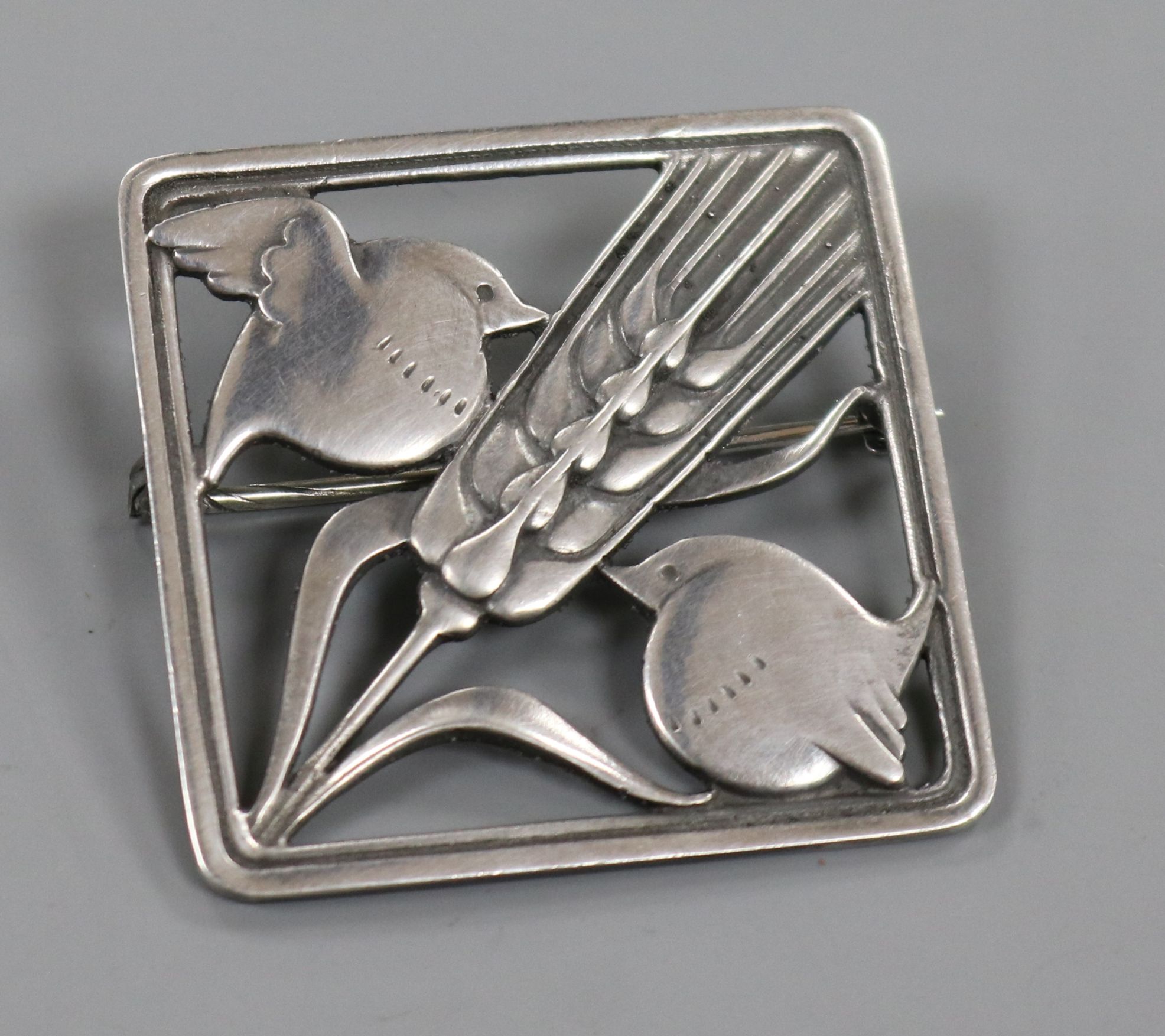 A Danish Georg Jensen sterling silver 'two robins and wheatsheaf ' brooch, no. 250, 36mm.