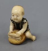 A Japanese ivory inlaid figurative netsuke