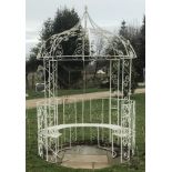 A white painted wrought iron circular gazebo combined seat This lot may be viewed on site at a