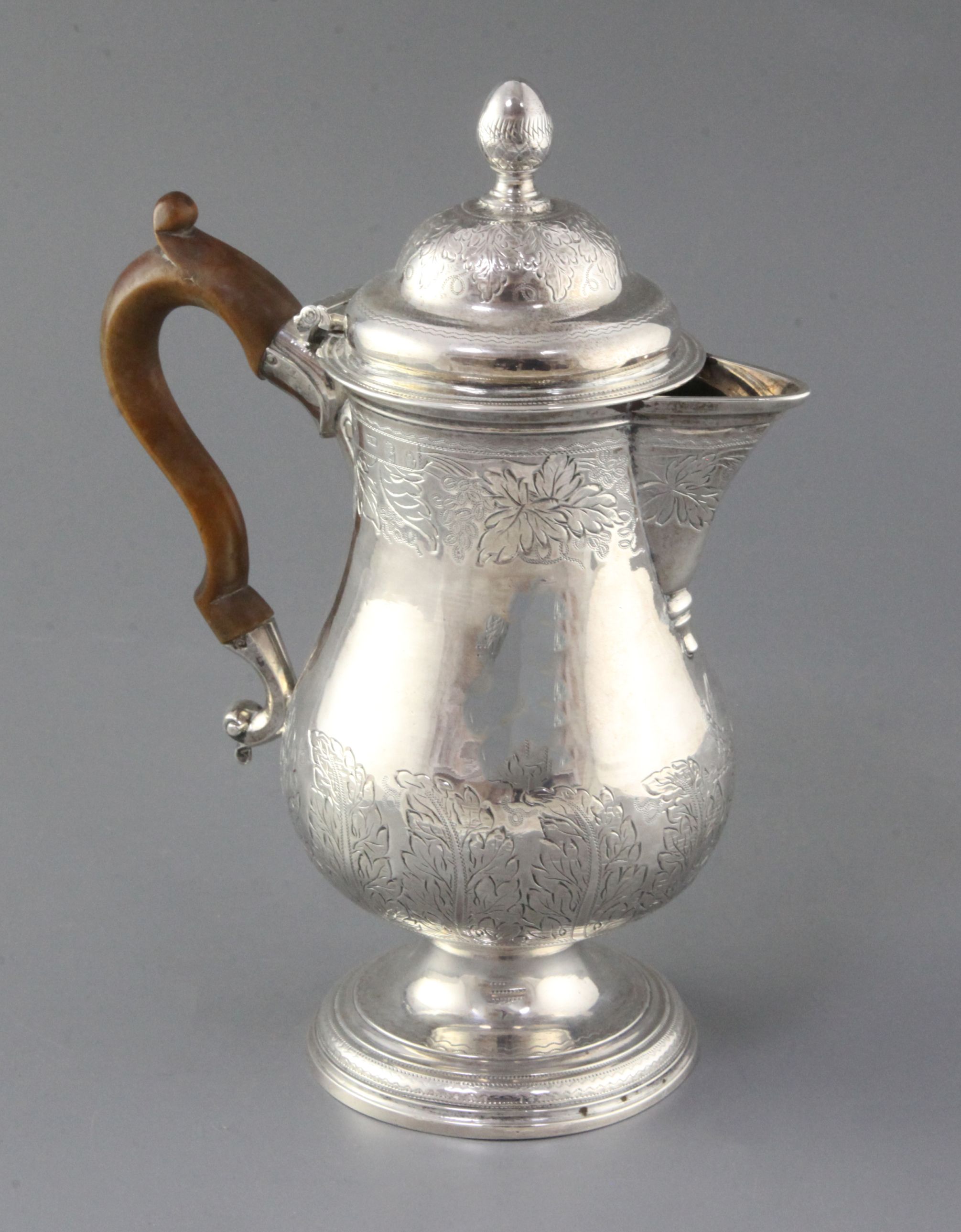 A George III Irish silver pedestal hot water/coffee pot by Matthew West, of baluster form, with
