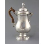A George III Irish silver pedestal hot water/coffee pot by Matthew West, of baluster form, with
