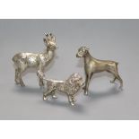 A silver model of a poodle and two other model animals.