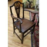 A set of seven George III provincial oak and elm dining chairs