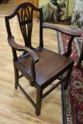 A set of seven George III provincial oak and elm dining chairs