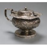 A George IV embossed silver pedestal mustard pot, Abstinando King, London, 1822.
