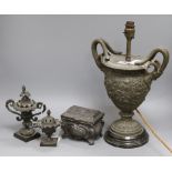 A metal two handled putti decorated table lamp, a metal box, a censer and a lamp