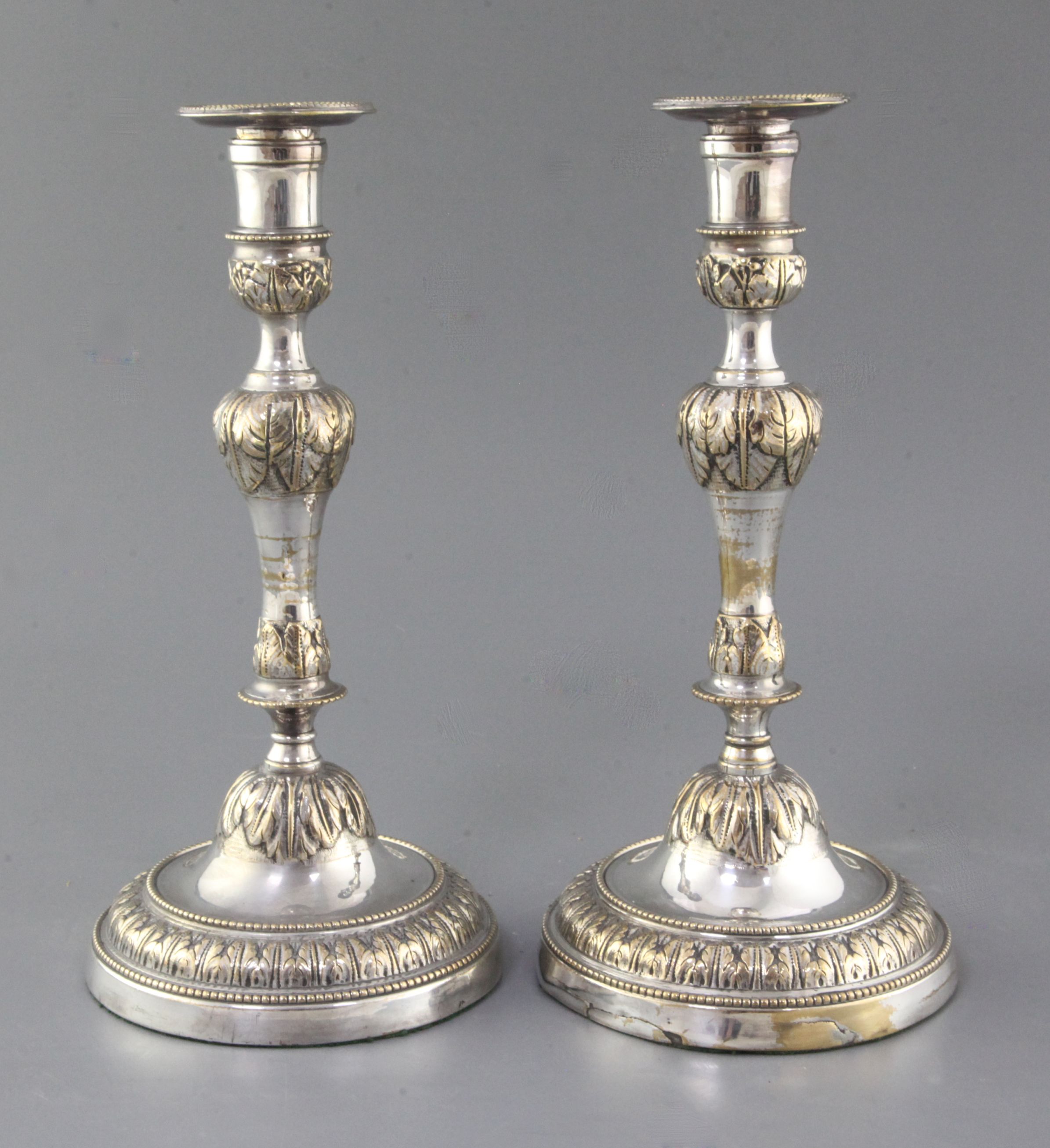 A pair of French Louis XV silver plated candlesticks, with waisted knopped stems, on circular bases,