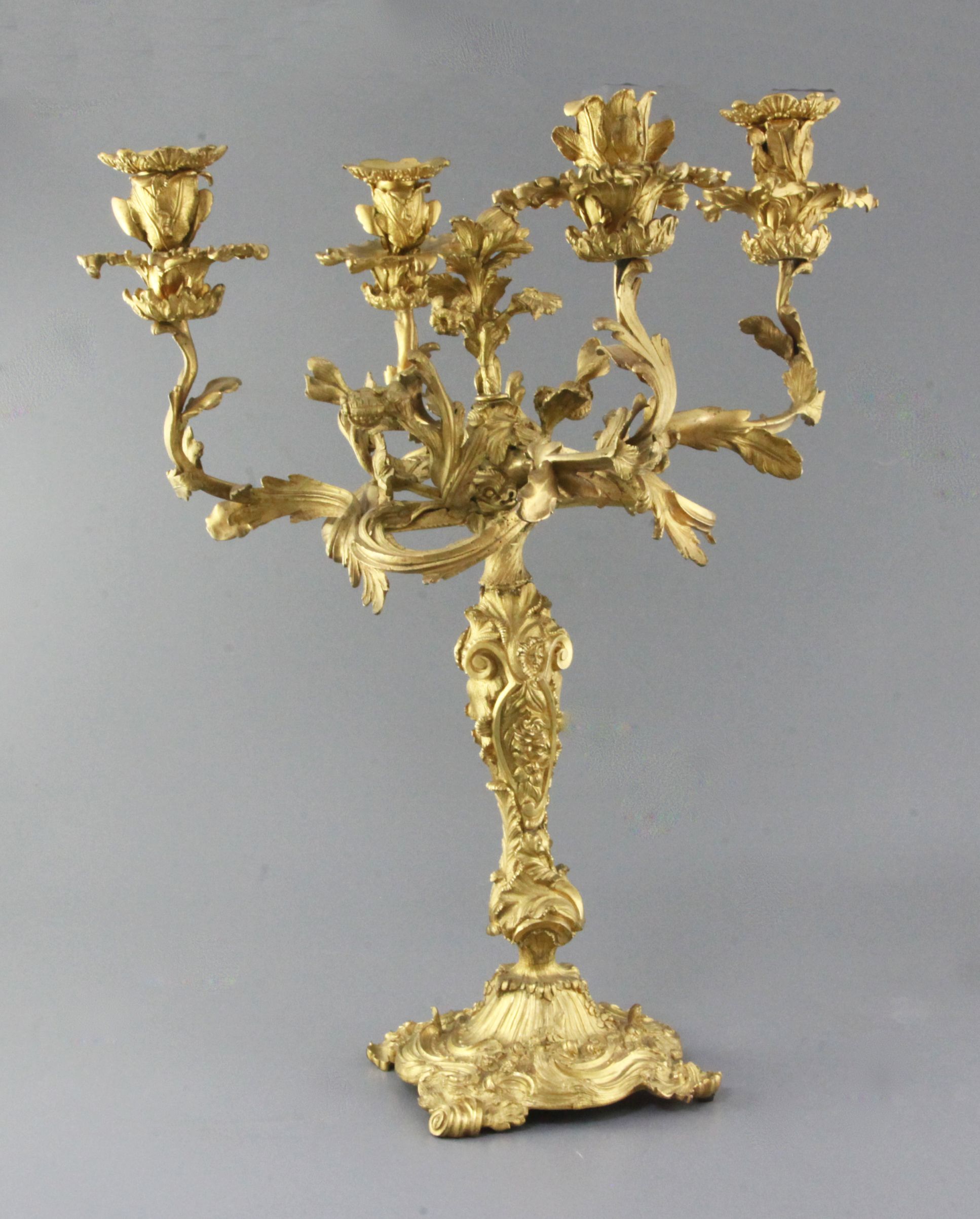 An early Victorian ormolu four light candelabrum, decorated with flowers and scrolls, height 20.