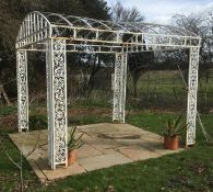 A large white painted wrought iron gazebo This lot may be viewed on site at a property at Pett,