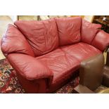 A red leather settee W.220cm