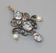 A late Victorian yellow and white metal, pale aquamarine and pearl set lozenge shaped drop