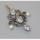 A late Victorian yellow and white metal, pale aquamarine and pearl set lozenge shaped drop