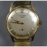 A gentleman's 9ct gold Longines manual wind wrist watch, on associated flexible strap, with case