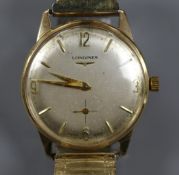 A gentleman's 9ct gold Longines manual wind wrist watch, on associated flexible strap, with case