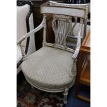 A pair of painted lyre back elbow chairs