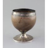 A George III silver mounted pedestal coconut cup, by Phipps & Robinson, with reeded foot, London,