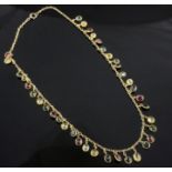 An early-mid 20th century gold and multi-coloured tourmaline drop fringe necklace, set with thirty