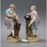 A pair of Meissen figures of boys with birds nests a.f.