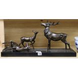 An Art Deco bronze group of a stag and two deer length 62cm (a.f.)