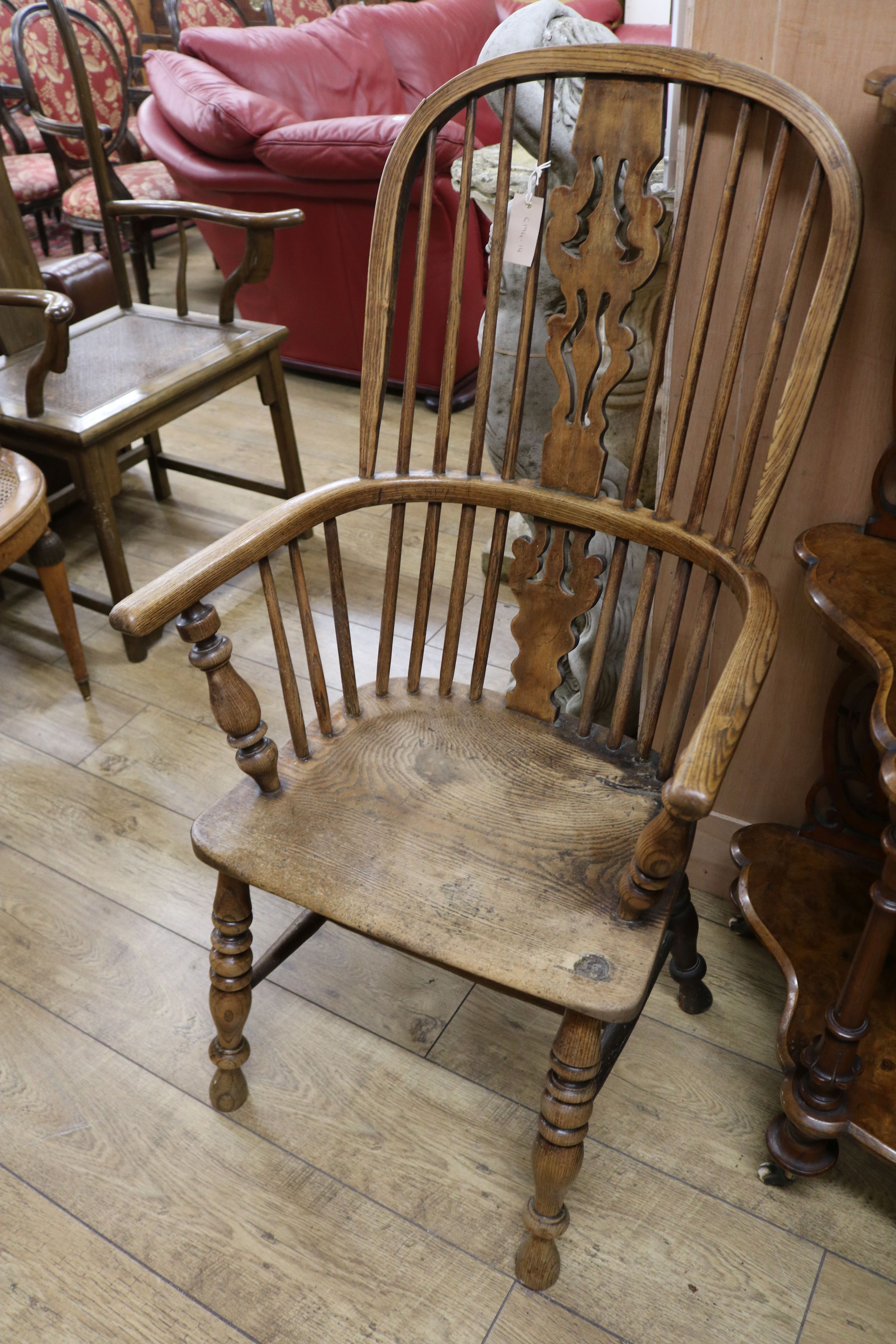 A 19th century ash, alder and elm Windsor armchair