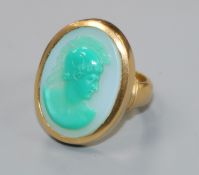 A 1950's 22ct gold and sardonyx set oval ring, carved with head of a Roman soldier to sinister, size