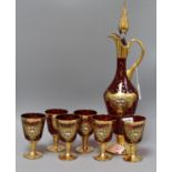 A Bohemian ruby glass and gilt claret jug and six glasses