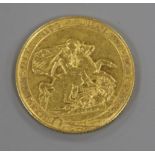 A George III gold sovereign, 1817, edge nick otherwise F.