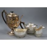 A matched late Victorian demi fluted silver four piece tea and coffee set, London, 1895 & Sheffield,