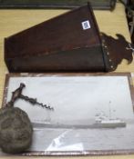 A carved stone head, candle box, corkscrew and photo of MV 'Golden Bay'