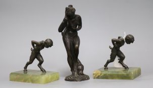 Two bronze and onyx bookends and a bronze figure tallest 21cm