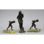 Two bronze and onyx bookends and a bronze figure tallest 21cm