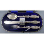 A Victorian cased silver christening trio, together with a later silver napkin ring.