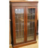 A bookcase with double glazed doors and three shelves W.92cm
