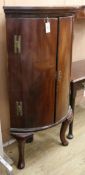 A George III mahogany bowfront corner cabinet on later cabriole legs W.78cm