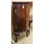 A George III mahogany bowfront corner cabinet on later cabriole legs W.78cm