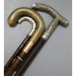 Two silver mounted and handled walking sticks and a horn, 9ct mounted walking stick